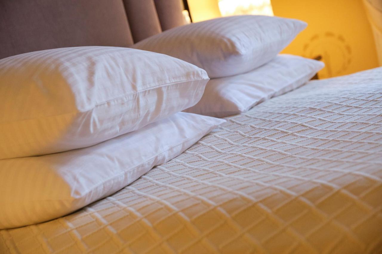 Villa Ammende Restaurant And Hotel Parnu Exterior photo Pillows on a bed